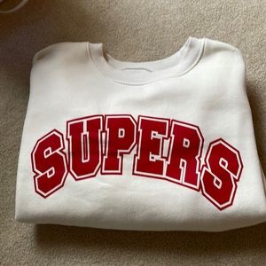 This is a pull over, it’s a size small and an off white color.